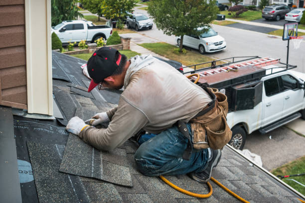 Professional Roofing technician working in Casey, IA